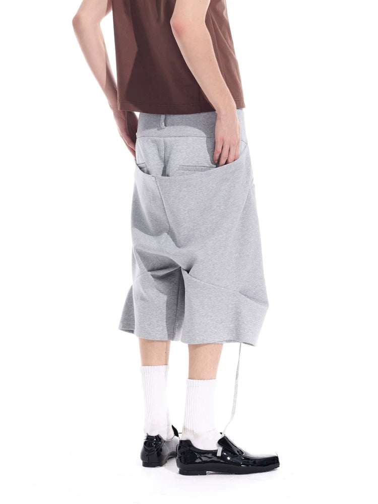 Cropped Pocketed Sashed Curved Hem Shorts