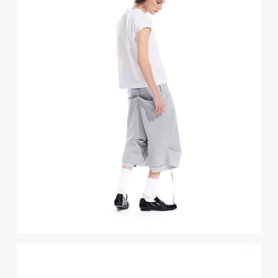 Cropped Pocketed Sashed Curved Hem Shorts