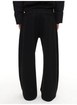 Slightly Curved Asymmetric Pleated Wool Pants