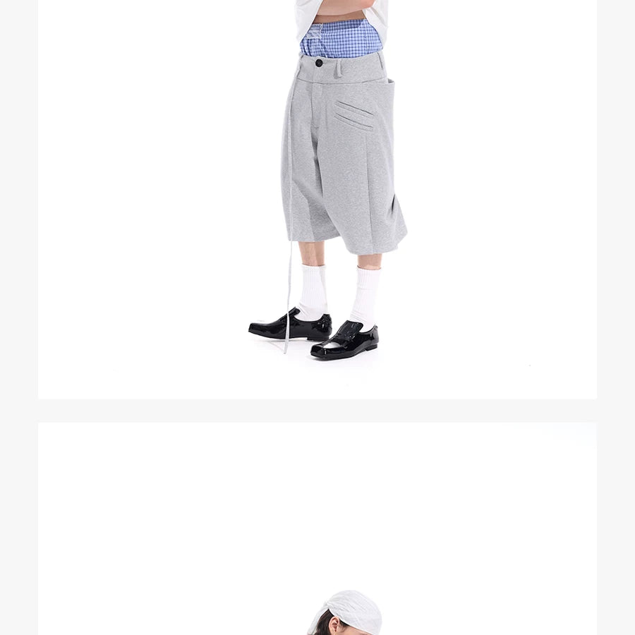 Cropped Pocketed Sashed Curved Hem Shorts