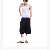 Cropped Pocketed Sashed Curved Hem Shorts